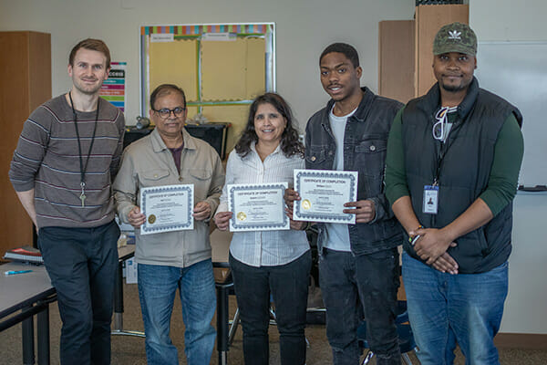 Image showing several graduates from the Avivo Institute of Career & Technical Education's Telecommunications Installation training program.