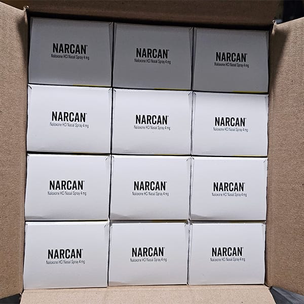 Photo of a box full of Narcan kits, part of Avivo's organization-wide high fidelity harm reduction strategy.